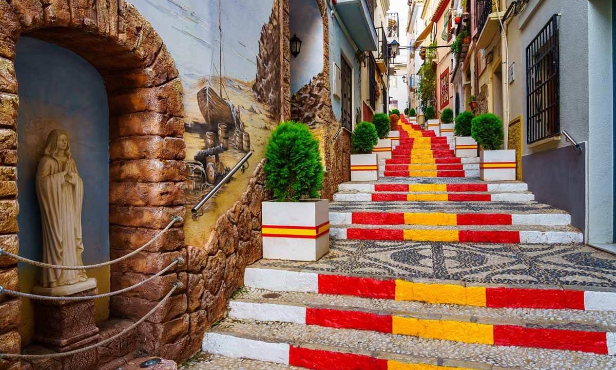 1200-narrow-alley-decorated-with-flag-spain-steps-calpe-alicante